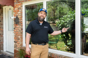 Home remodeling company walking through home window installation